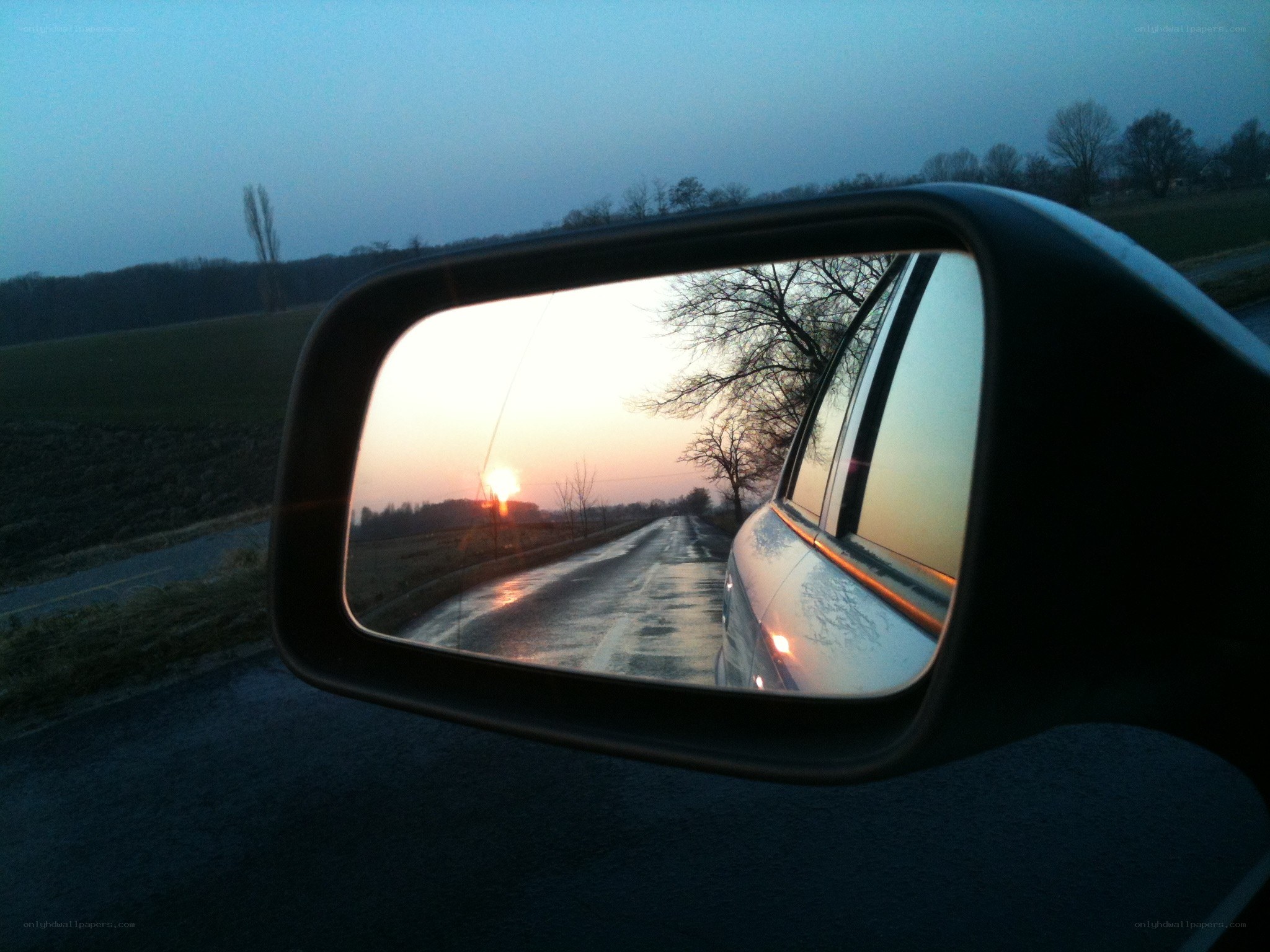 Sunset in the rearview mirror