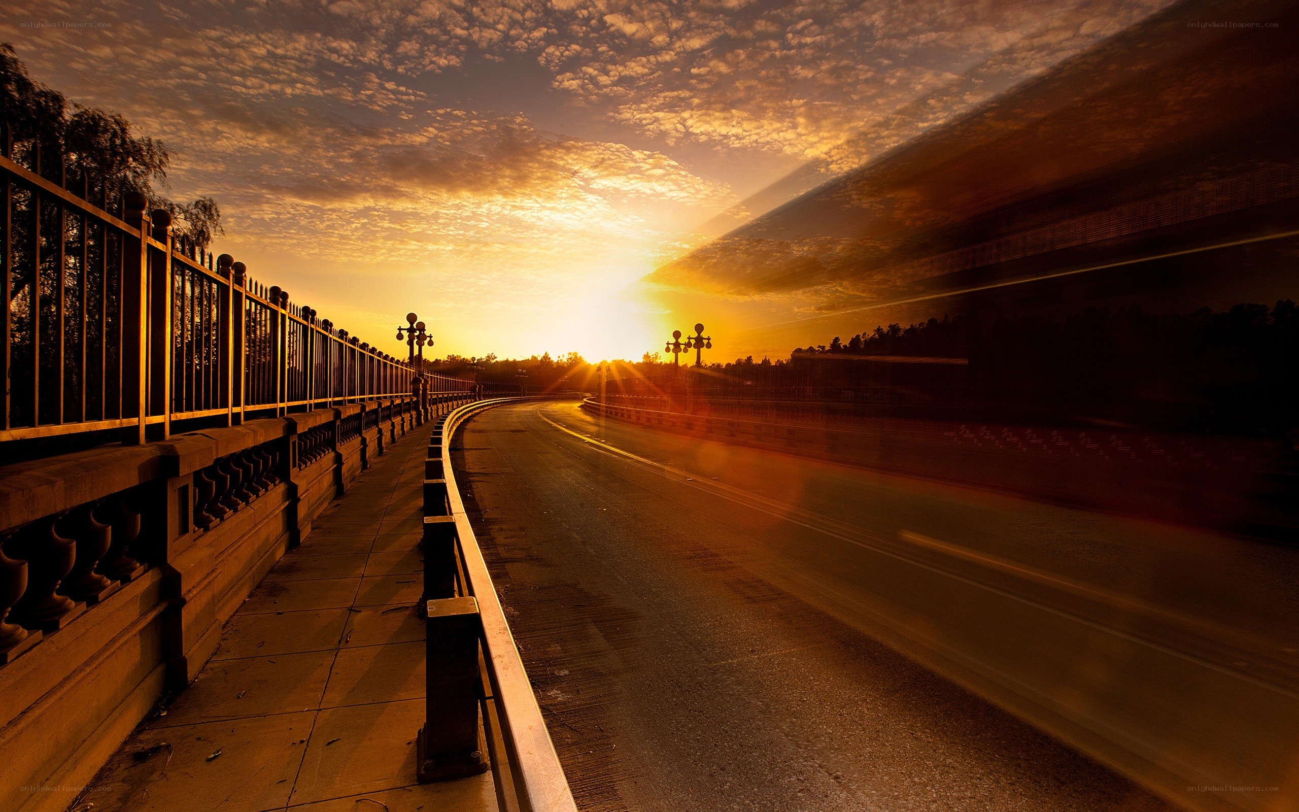 Sunset on a curved road