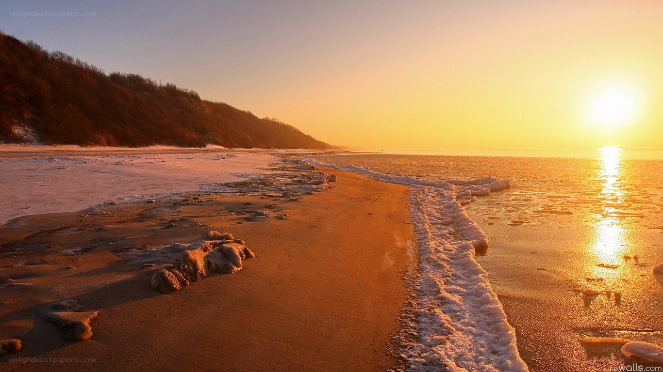 sunset on a frozen beach