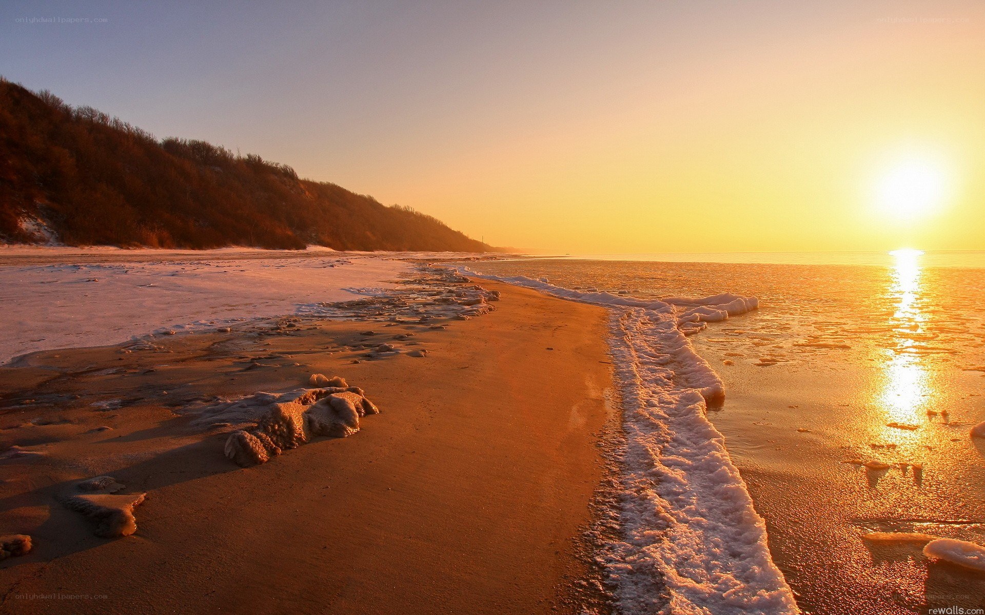 sunset on a frozen beach