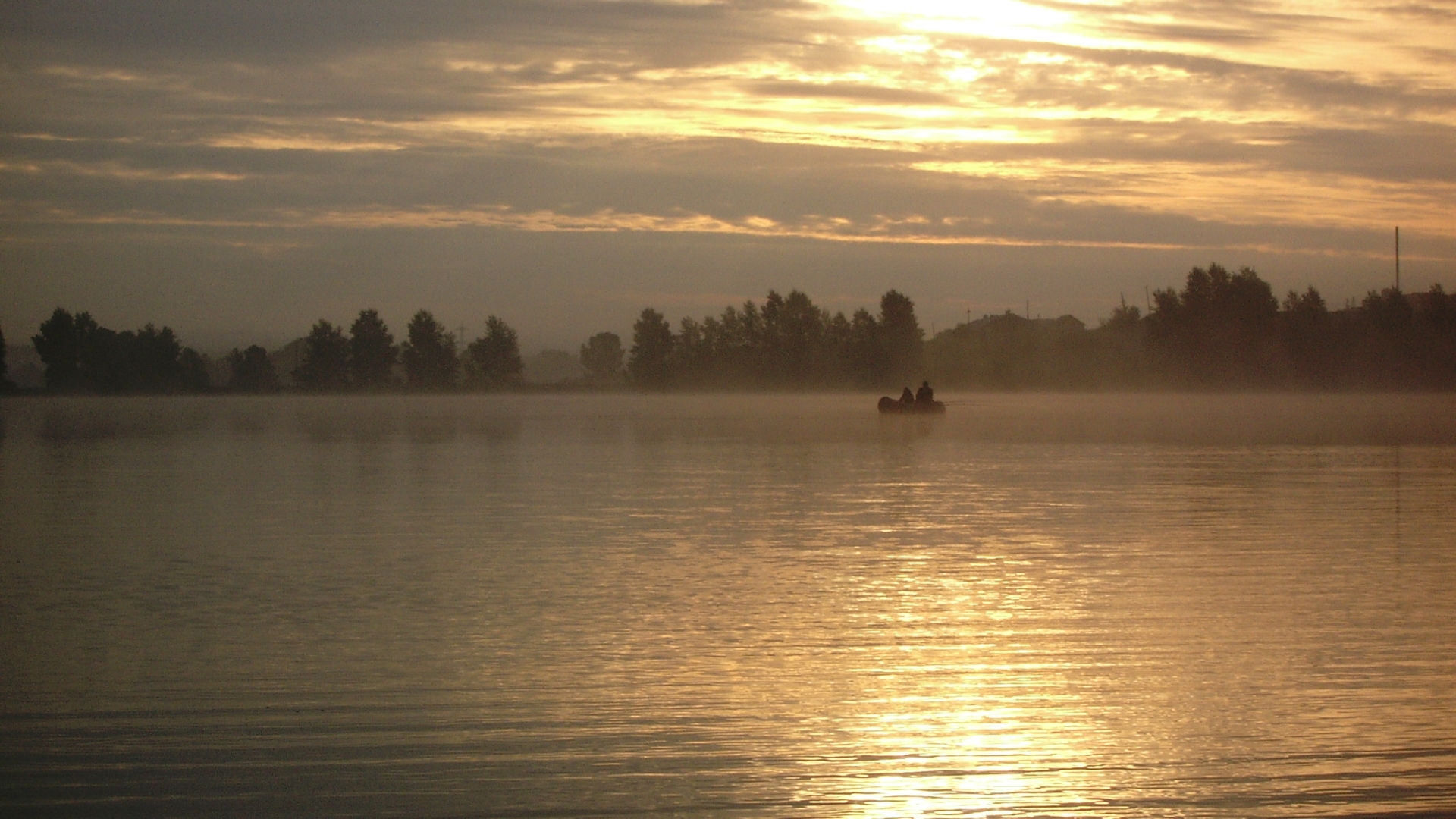 Sunset on a misty lake