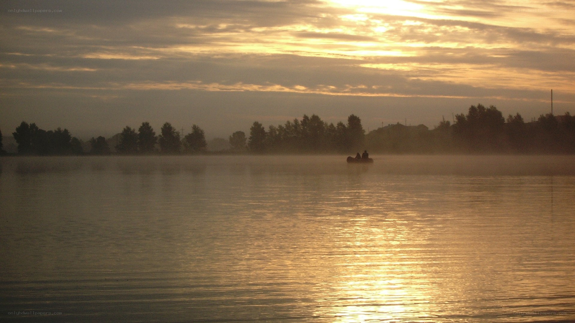 Sunset on a misty lake