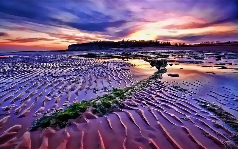 Sunset on a rippled beach