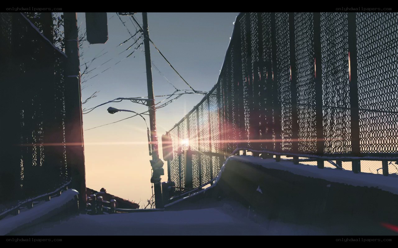 Sunset on a snowy bridge