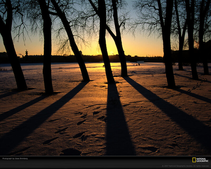 Sunset on a snowy riverbank