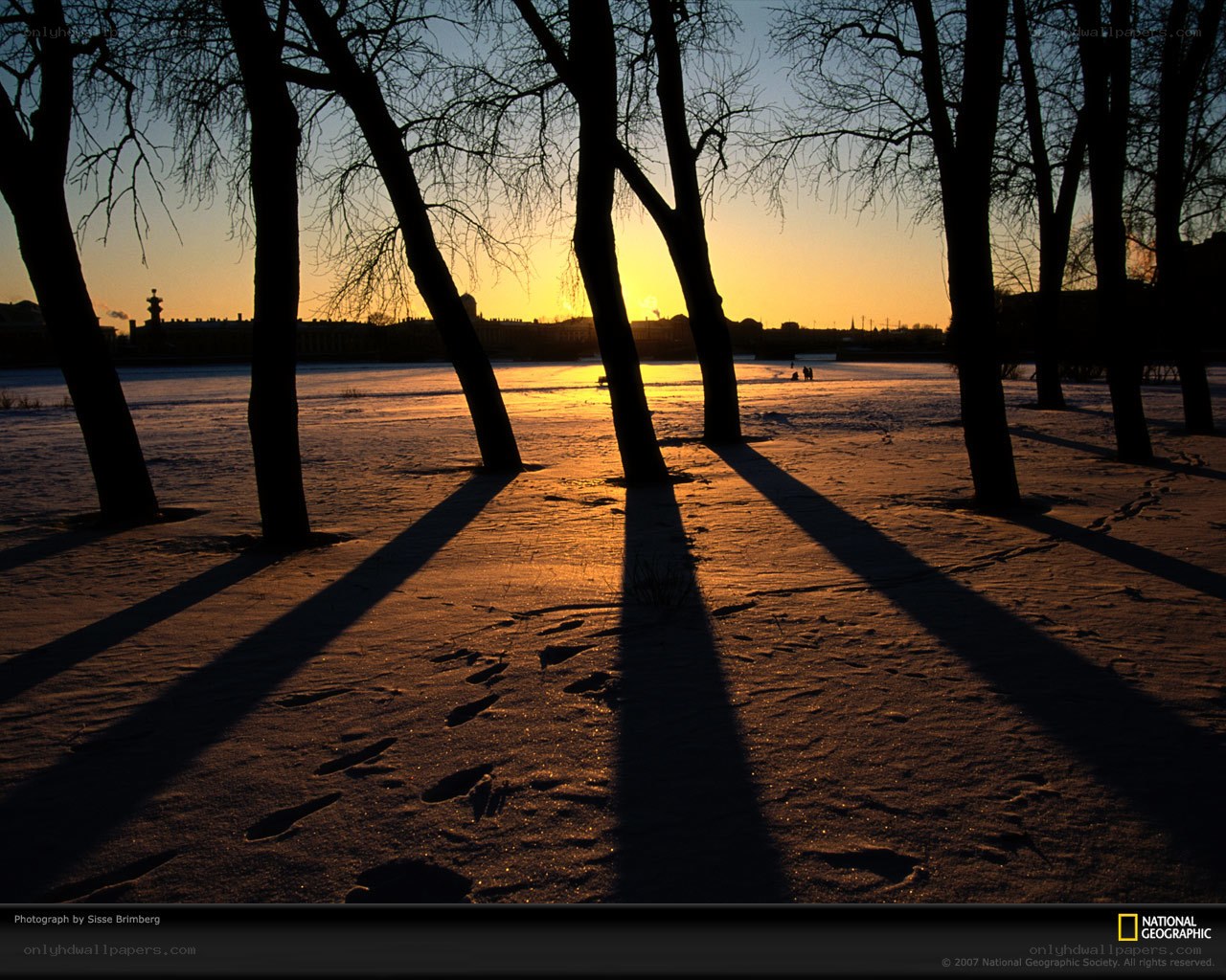 Sunset on a snowy riverbank