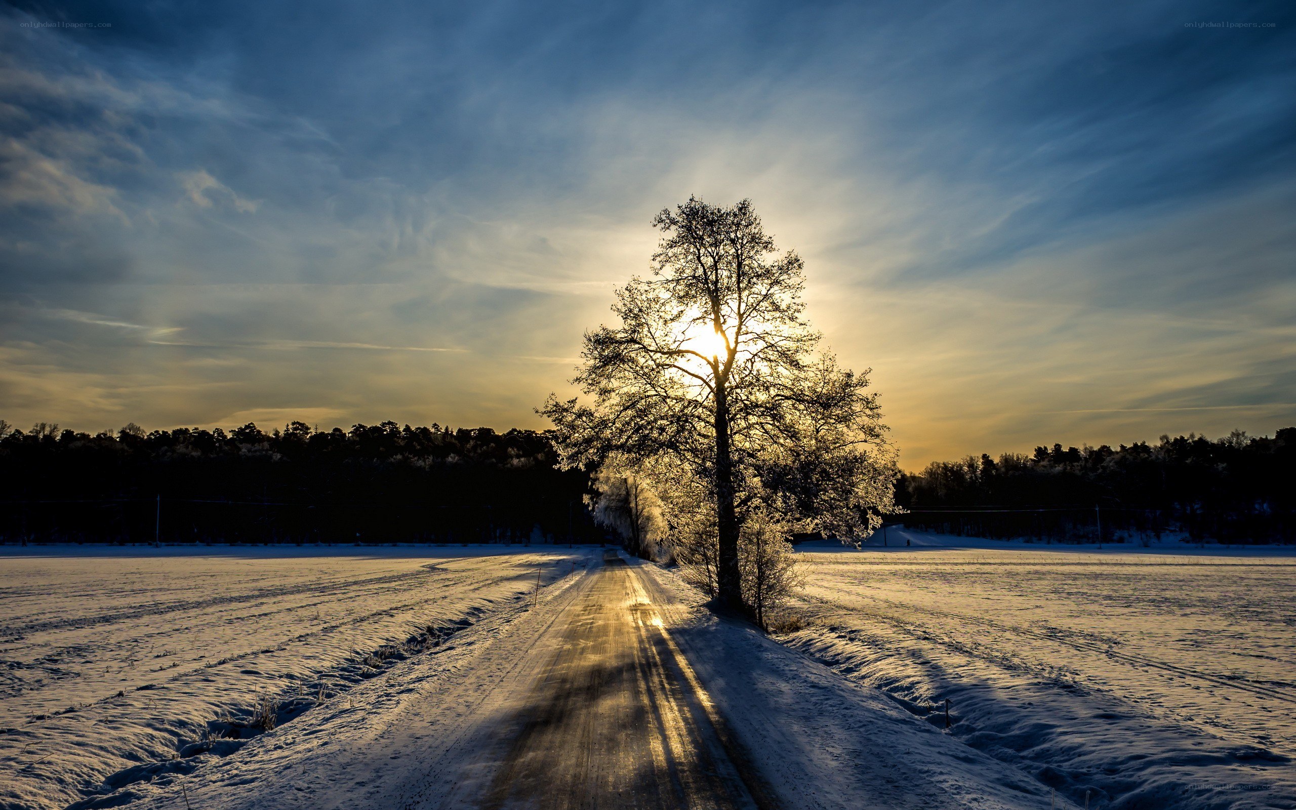 Sunset on a snowy road