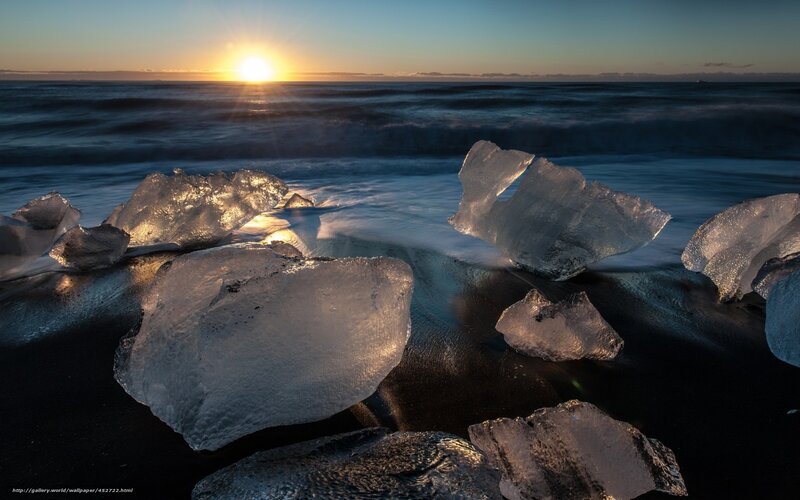 Sunset on ice-covered beach