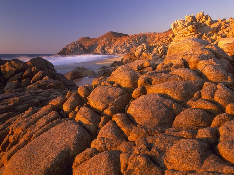Sunset on rocky beach
