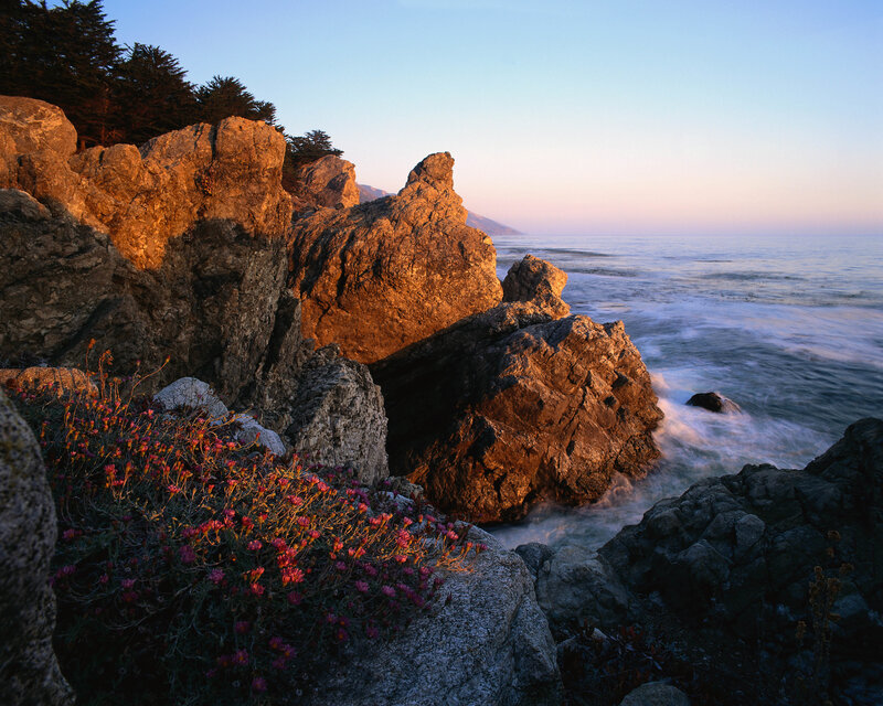 Sunset on rocky coastline