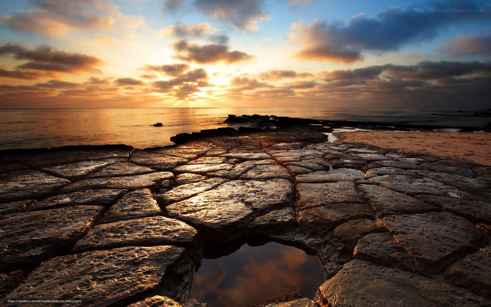 Sunset on rocky shoreline