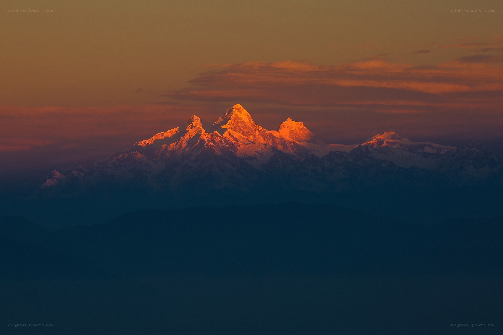 Sunset on snow-capped mountains