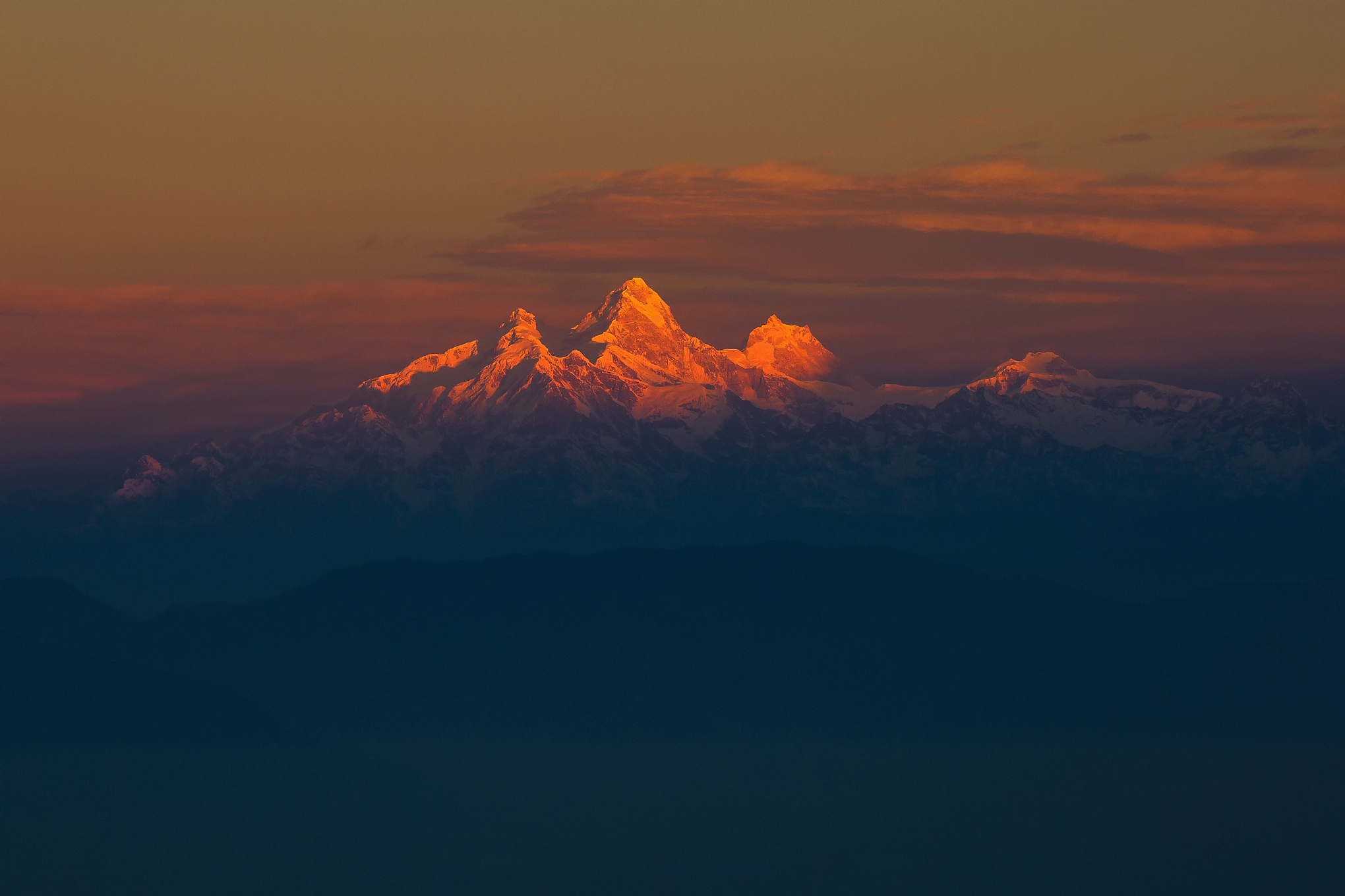 Sunset on snow-capped mountains