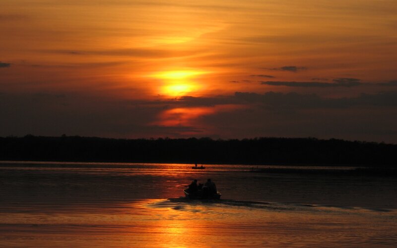 Sunset on the lake with boats