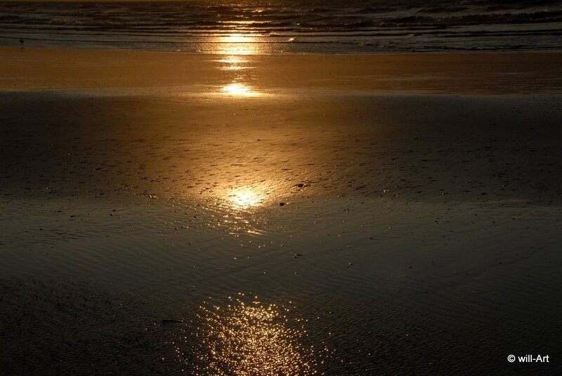 Sunset on the wet beach