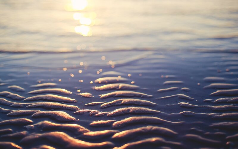 sunset on wet sand