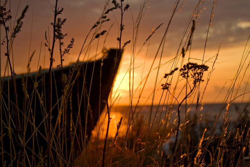 Sunset over a boat silhouette