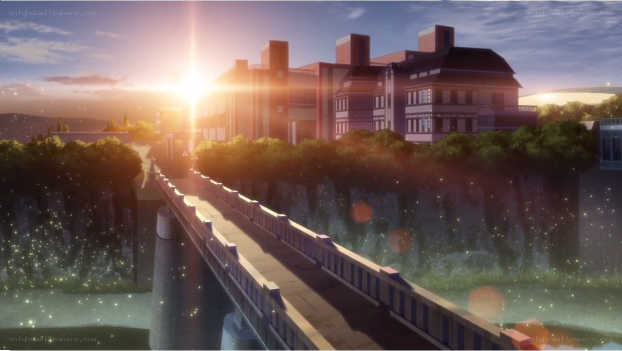 sunset over a bridge and buildings