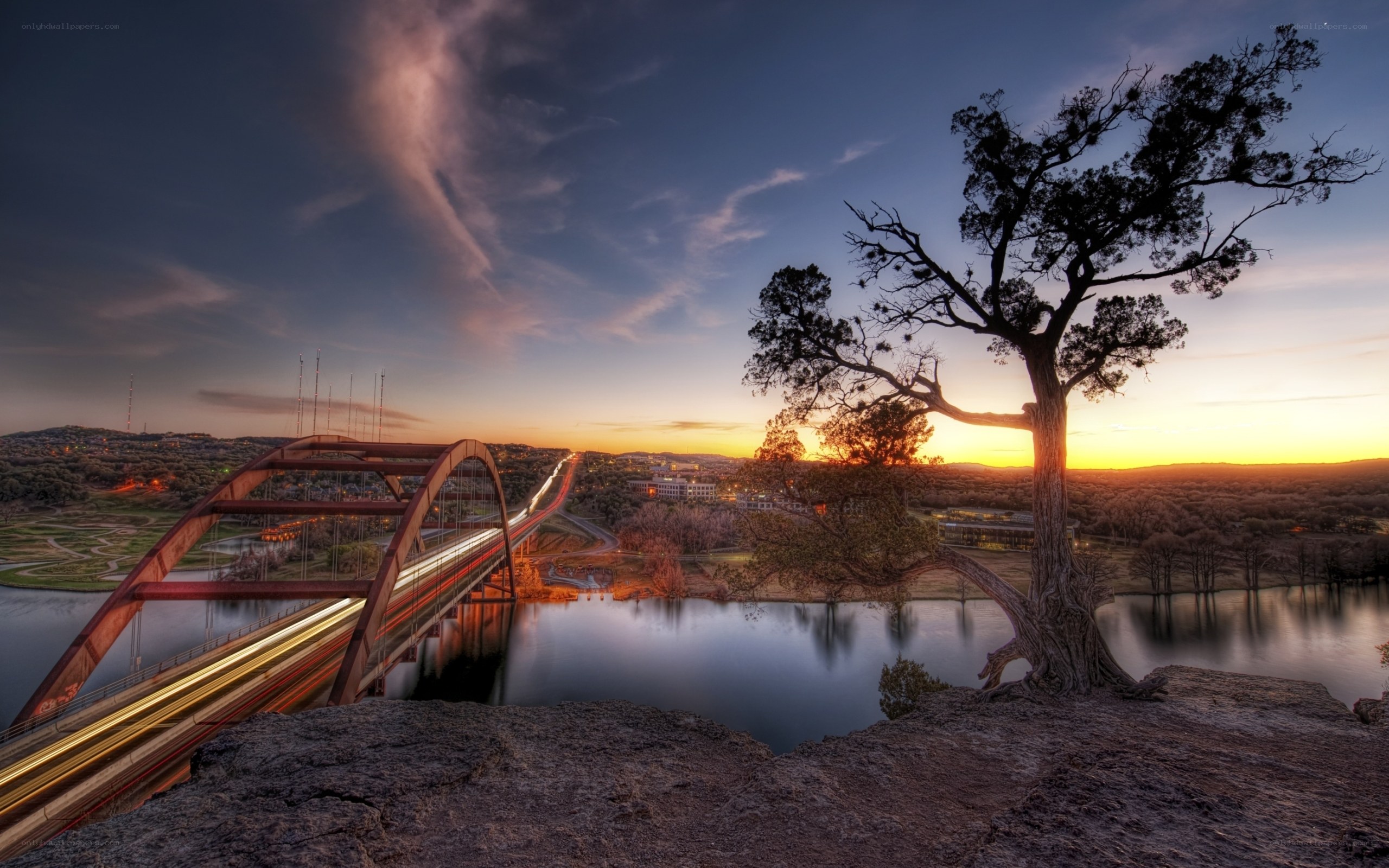 Sunset over a bridge and river