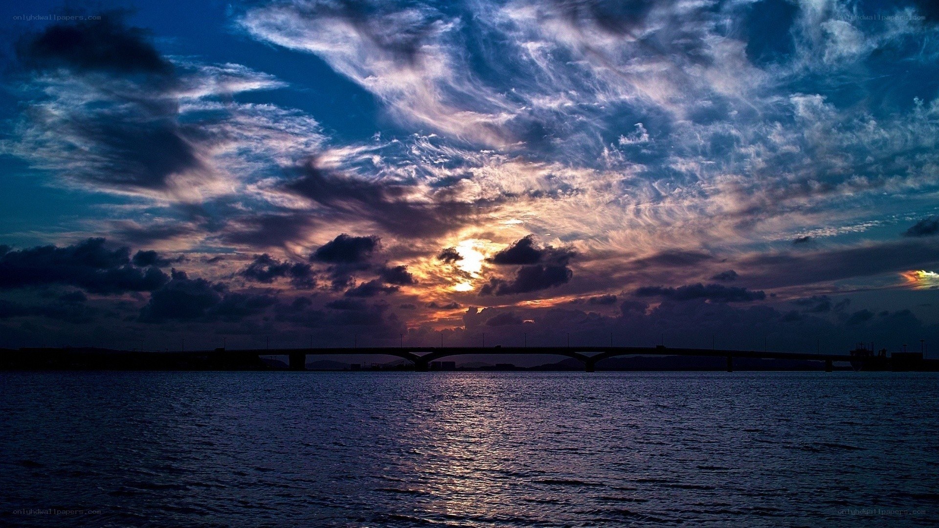 Sunset over a bridge at dusk
