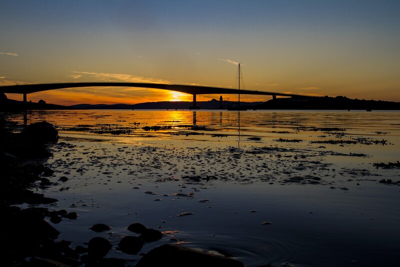 Sunset over a bridge at dusk