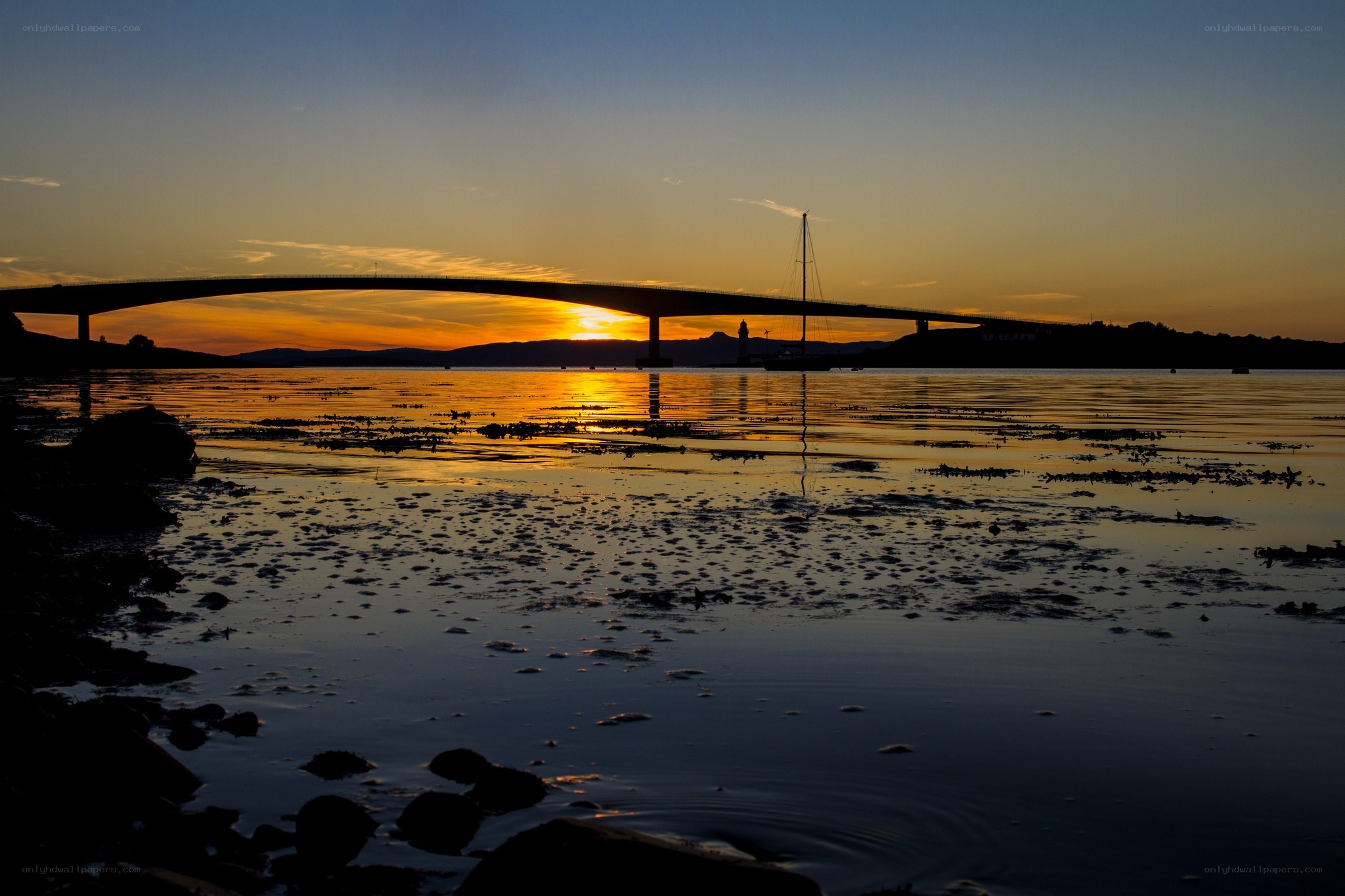 Sunset over a bridge at dusk