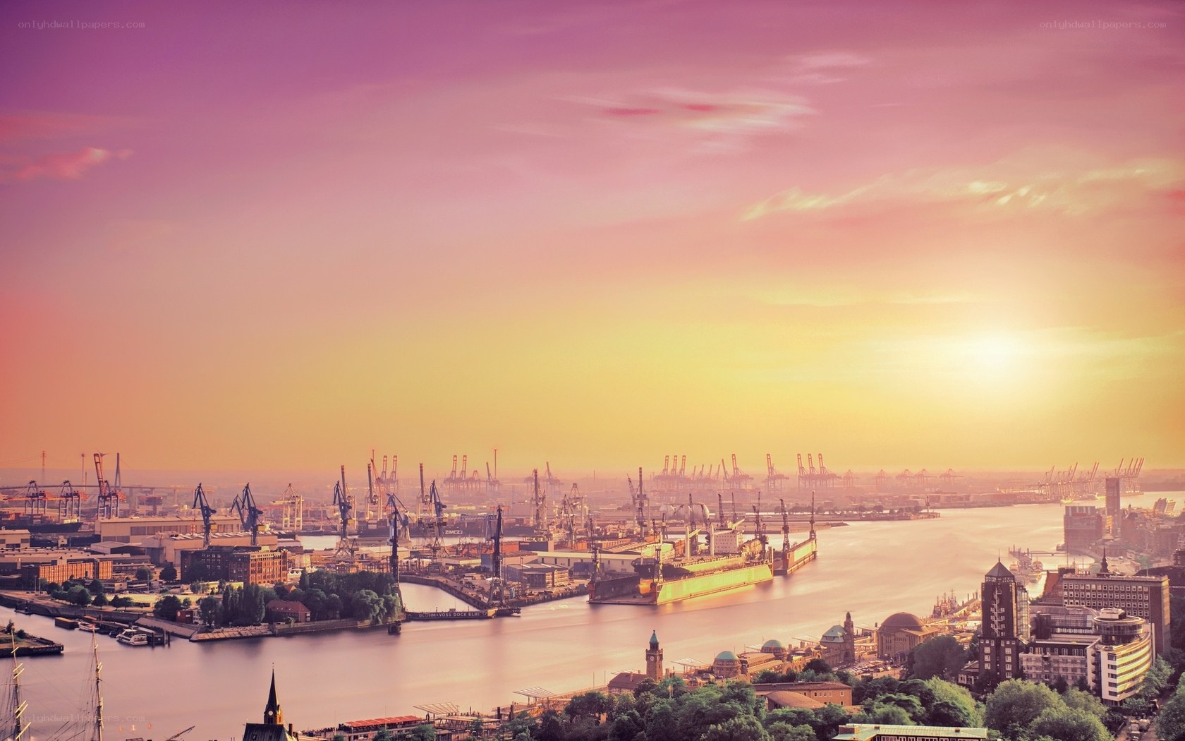 sunset over a busy port