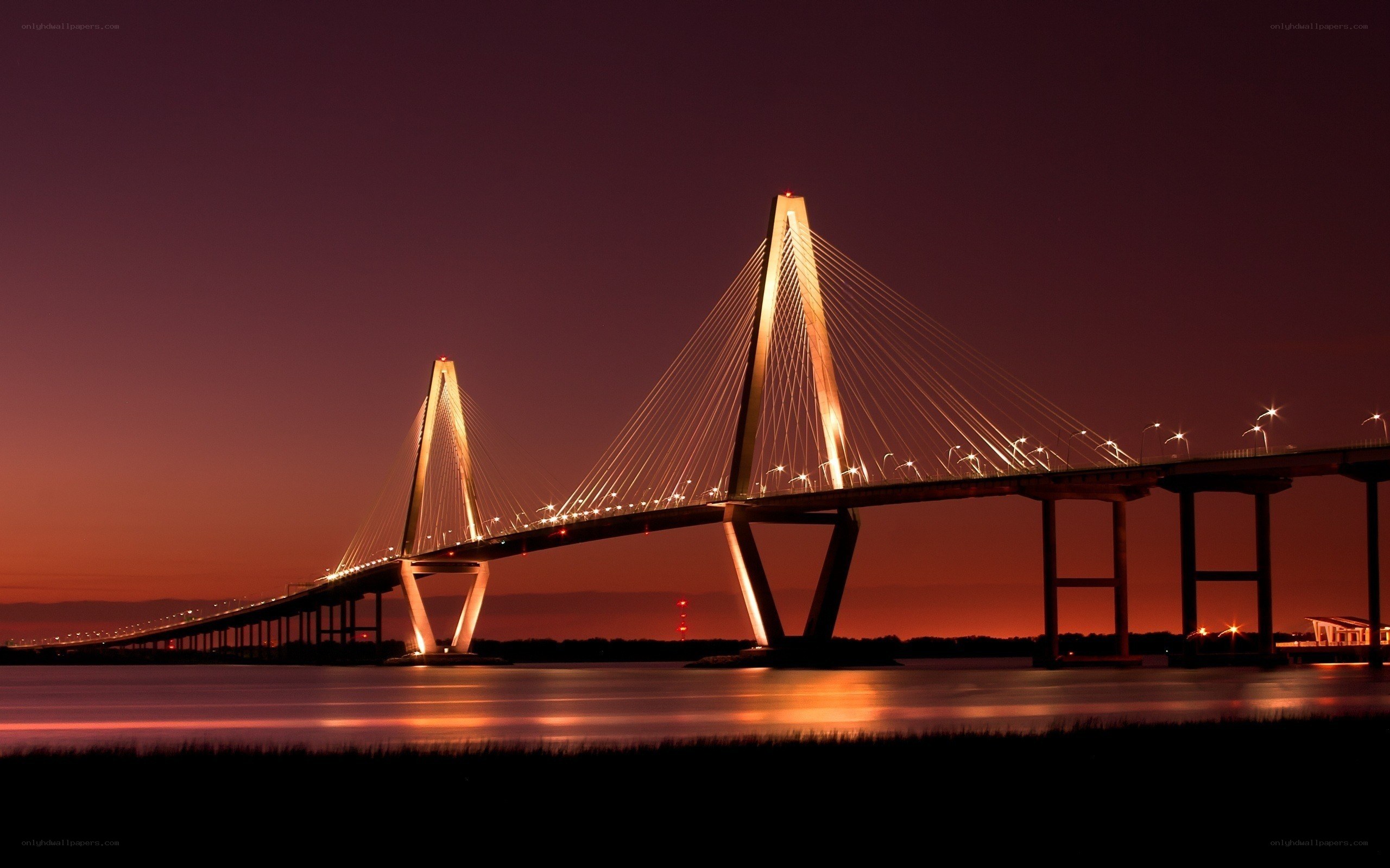 sunset over a cable-stayed bridge