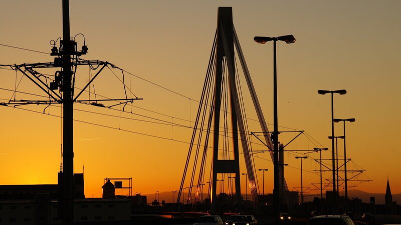 sunset over a cable-stayed bridge