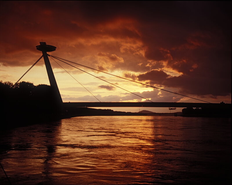 sunset over a cable-stayed bridge