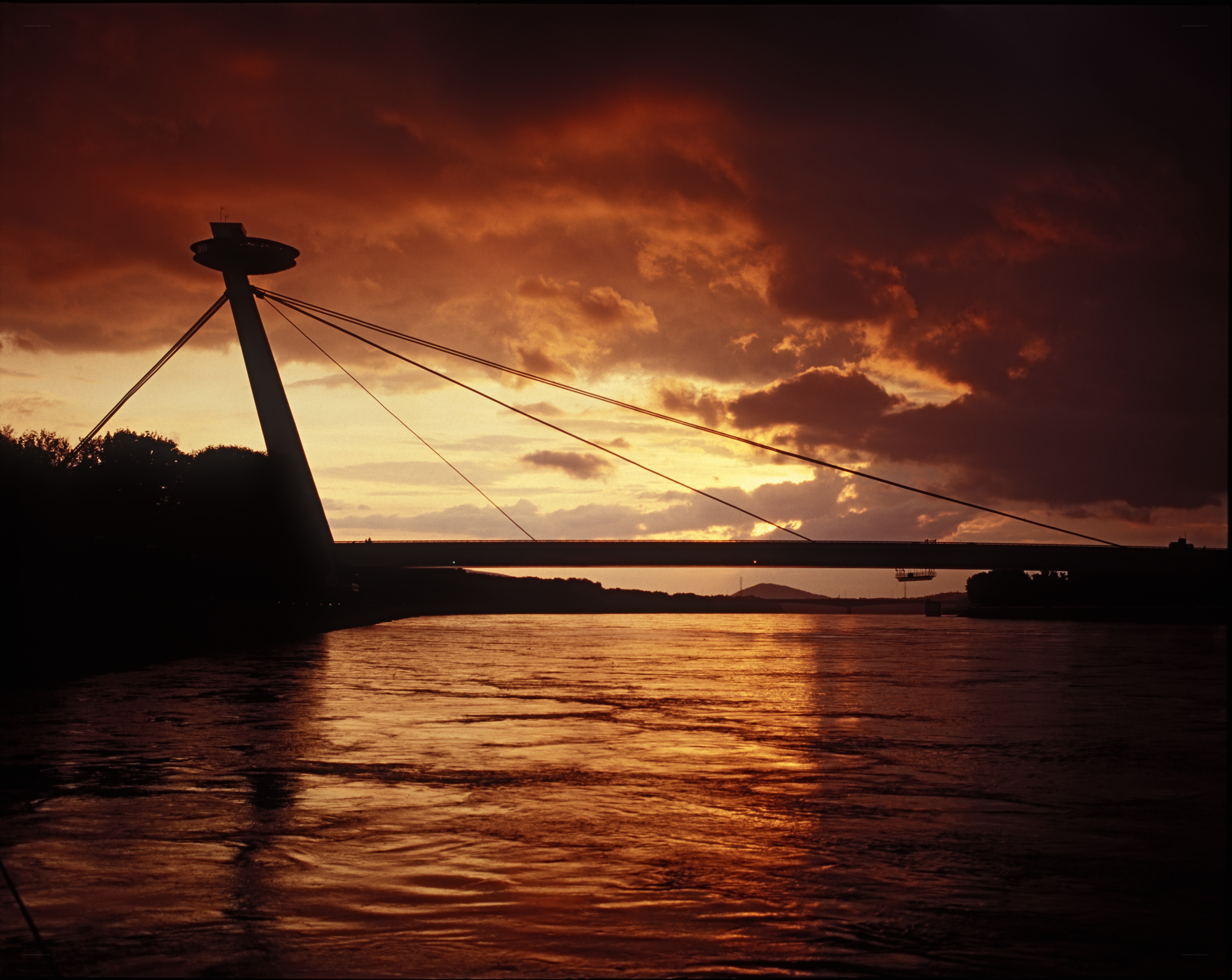 sunset over a cable-stayed bridge