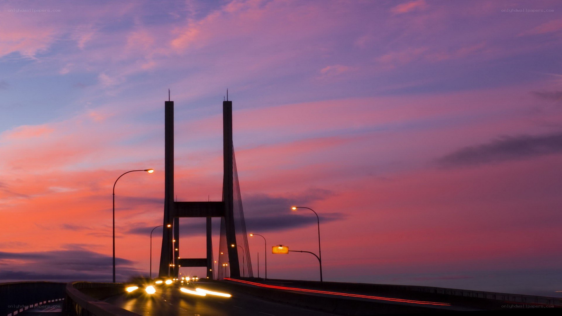 sunset over a cable-stayed bridge