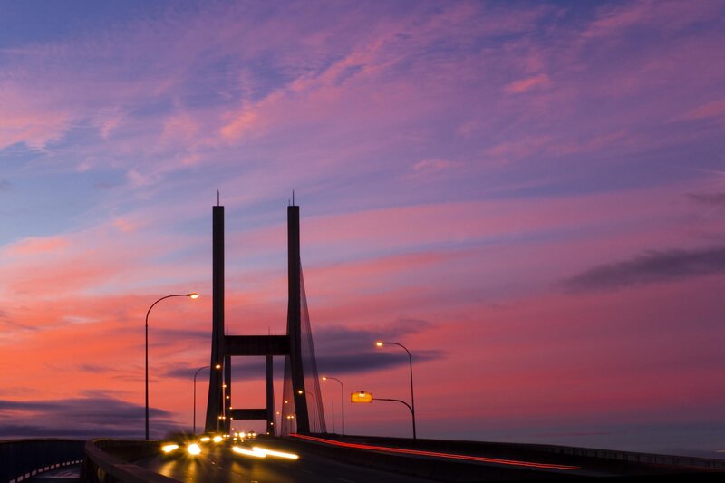 sunset over a cable-stayed bridge