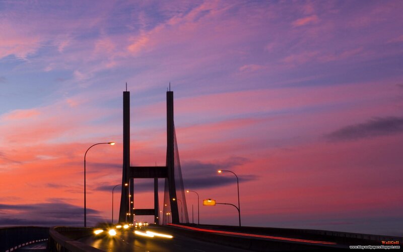 sunset over a cable-stayed bridge