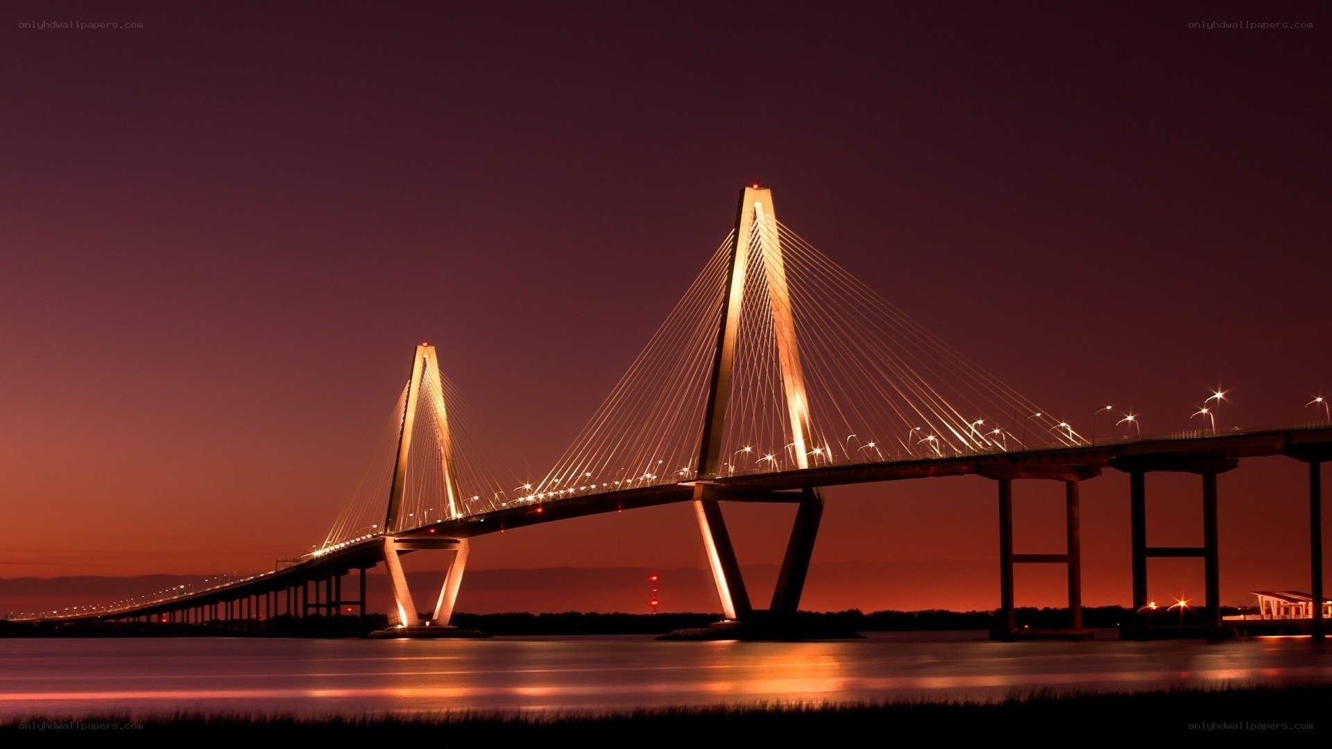sunset over a cable-stayed bridge