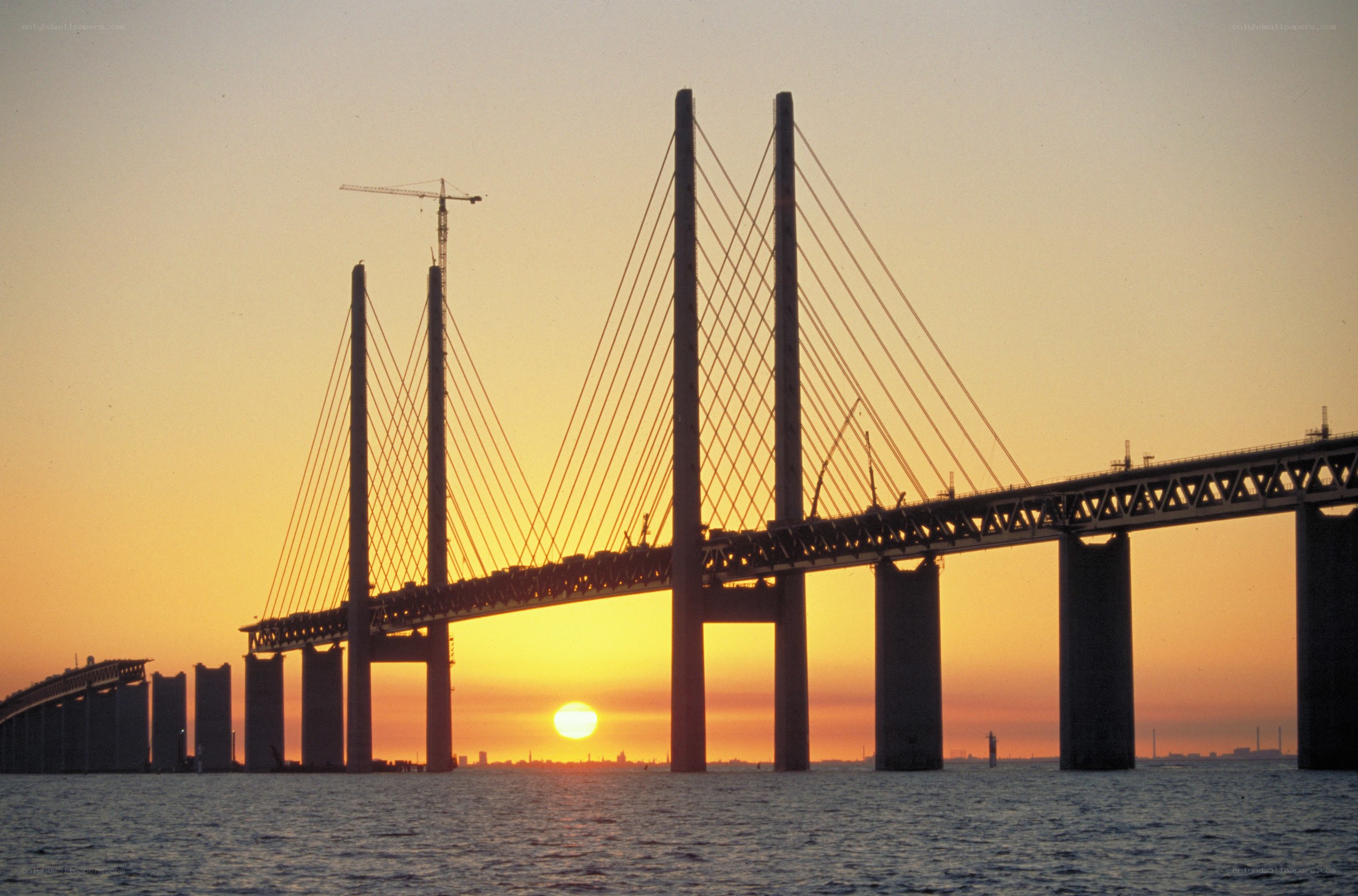 sunset over a cable-stayed bridge