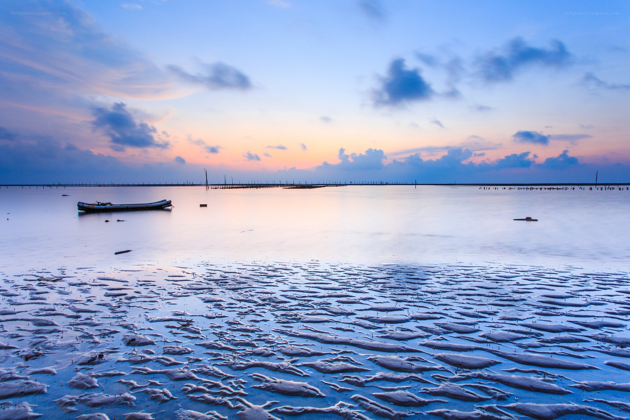 Sunset over a calm coastal bay