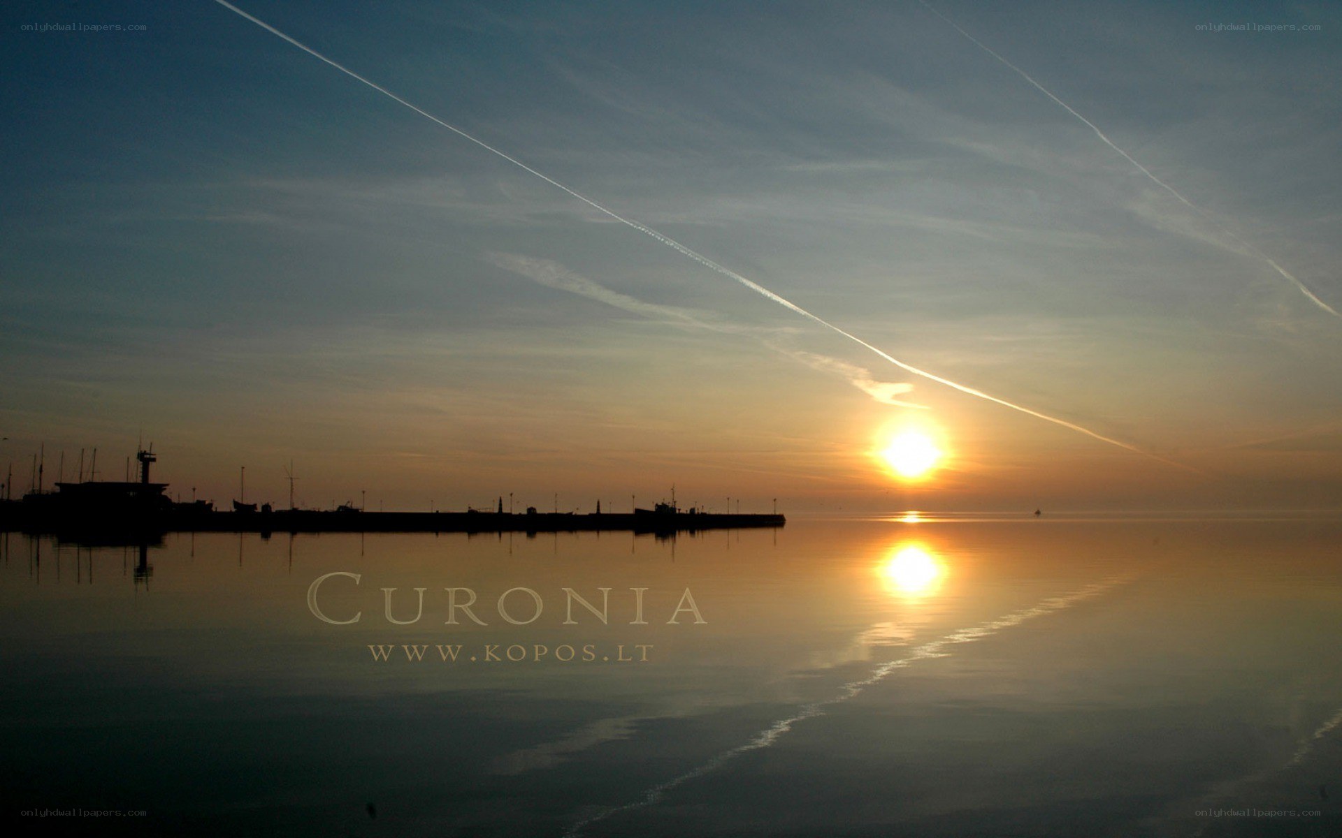 Sunset over a calm harbor