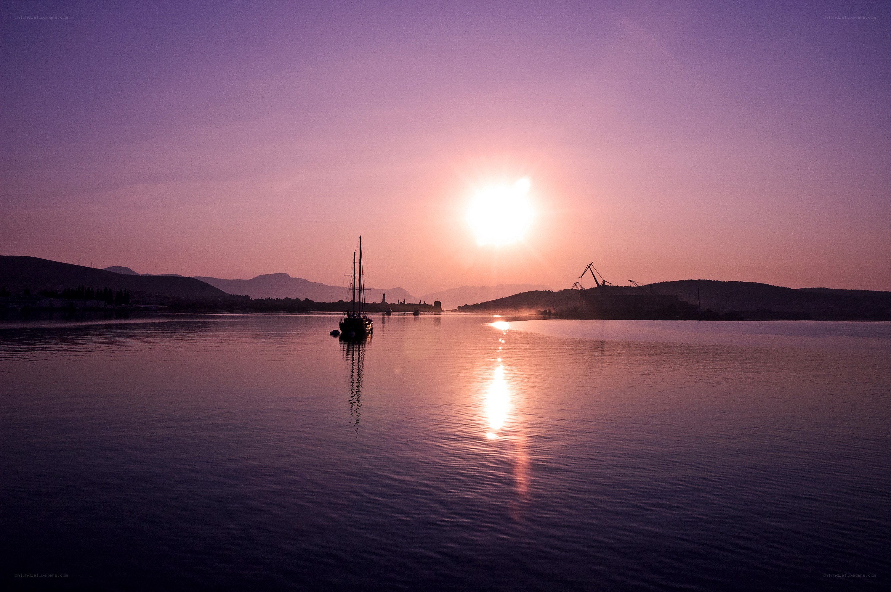 Sunset over a calm harbor