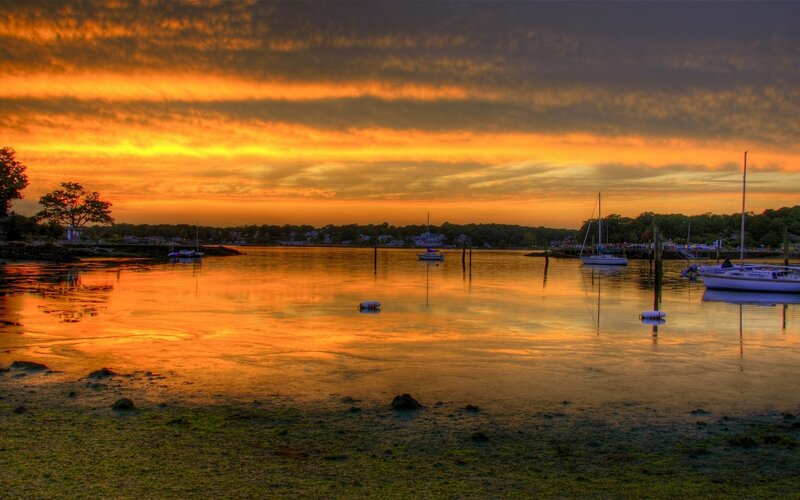 sunset over a calm harbor