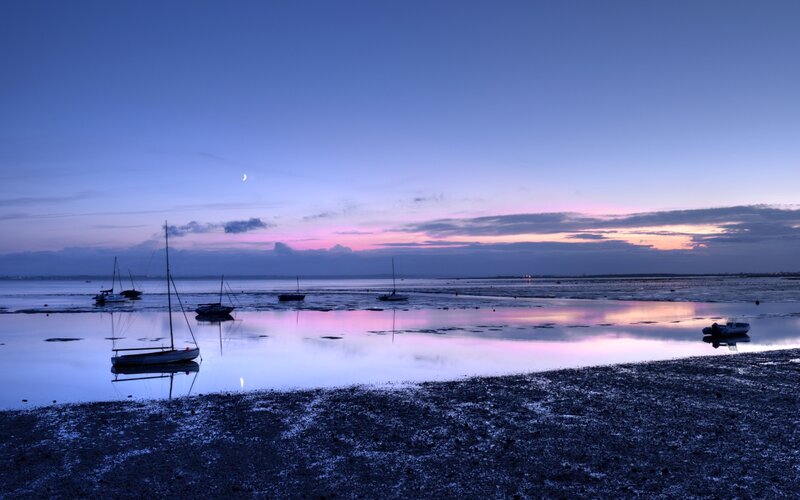 sunset over a calm harbor
