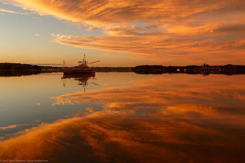 Sunset over a calm harbor