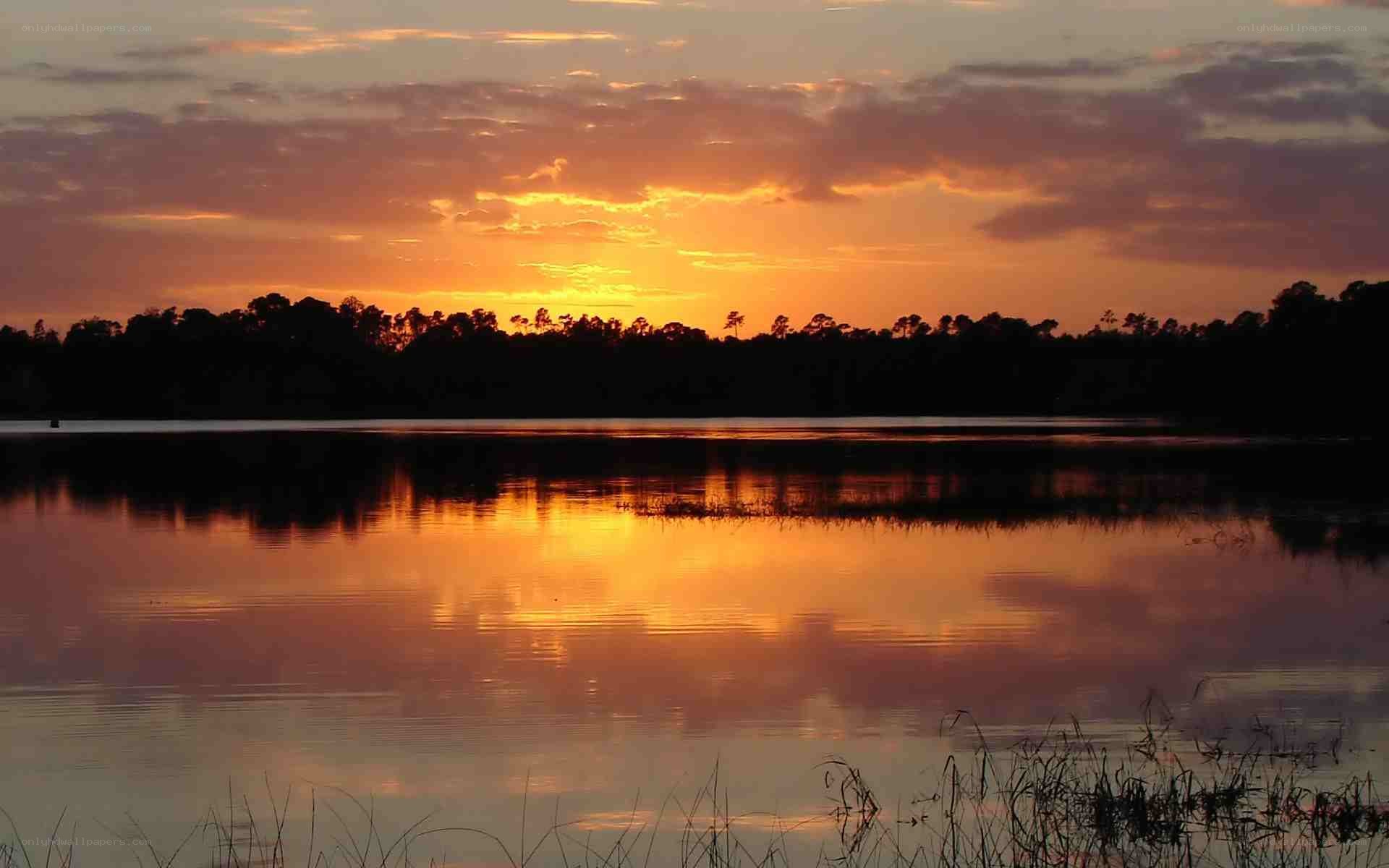 sunset over a calm lake