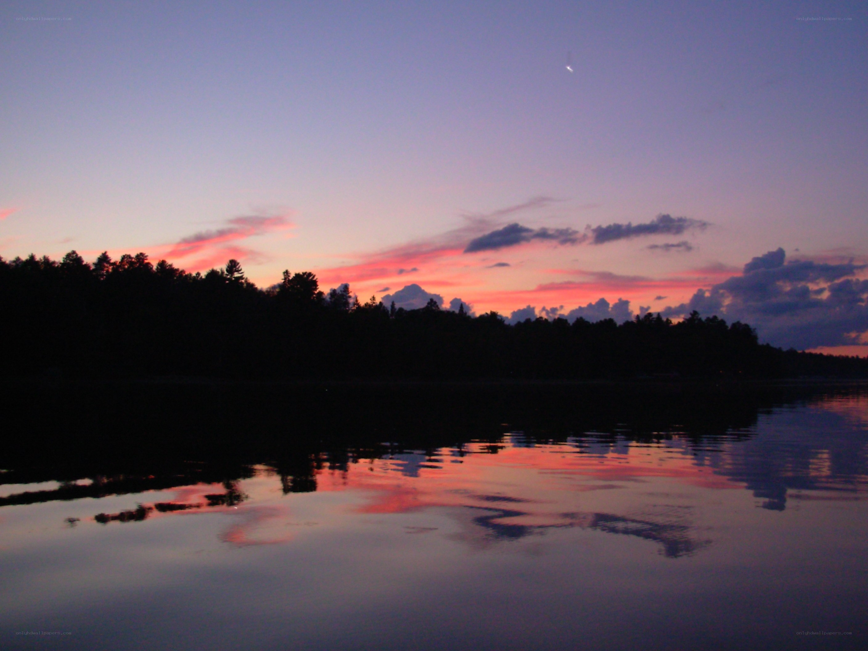 sunset over a calm lake