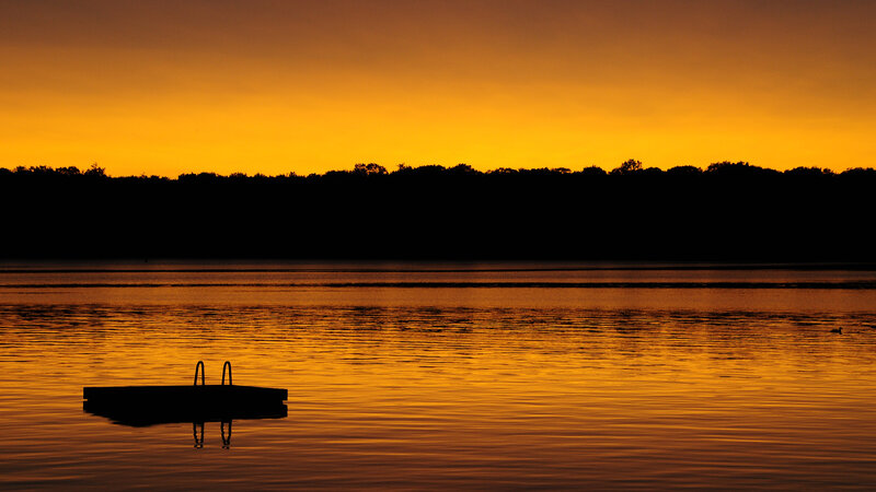 Sunset over a calm lake