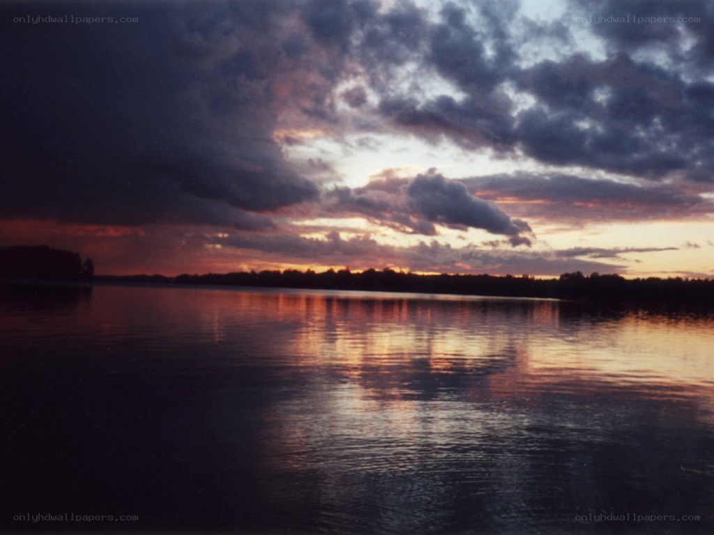 sunset over a calm lake