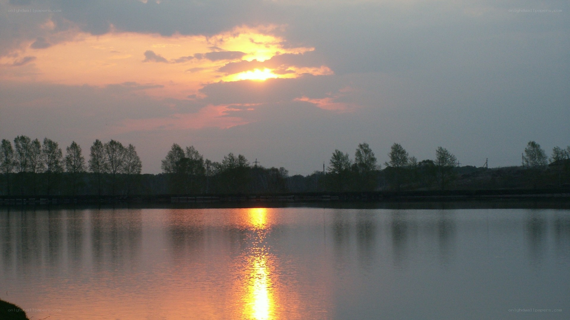 sunset over a calm lake