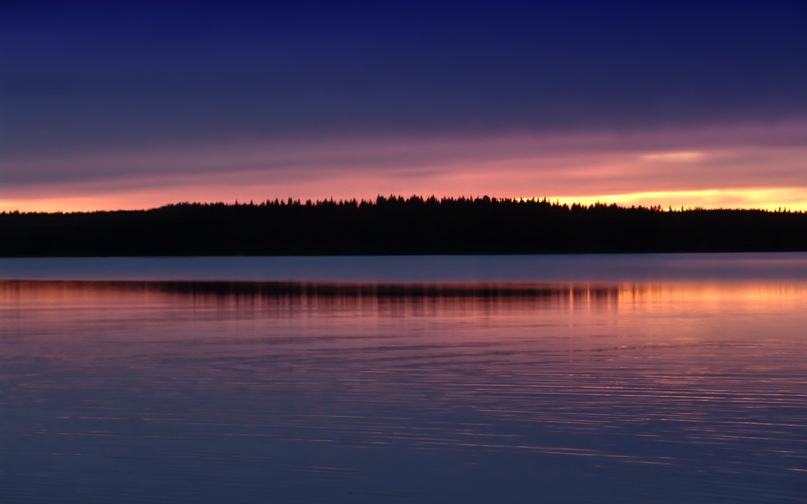 sunset over a calm lake