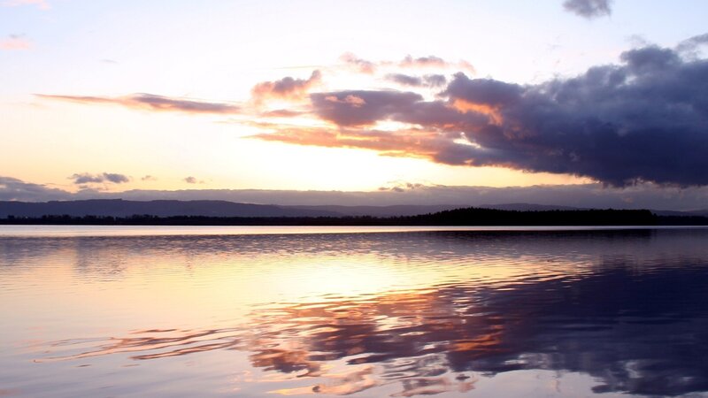 sunset over a calm lake