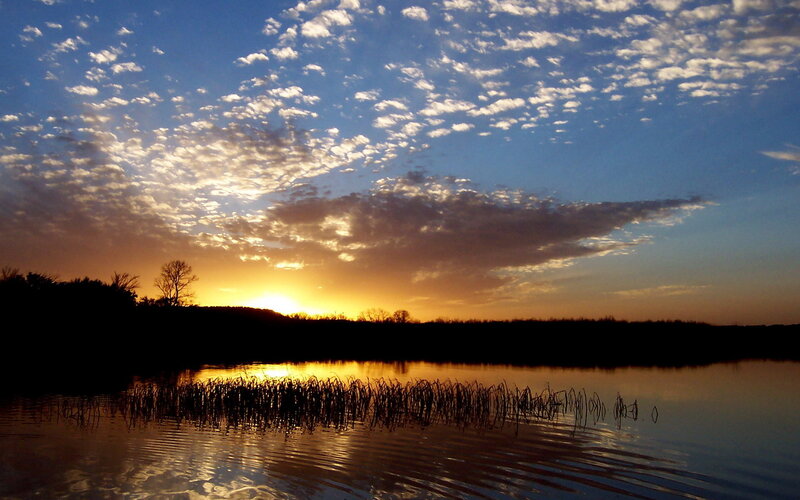 sunset over a calm lake